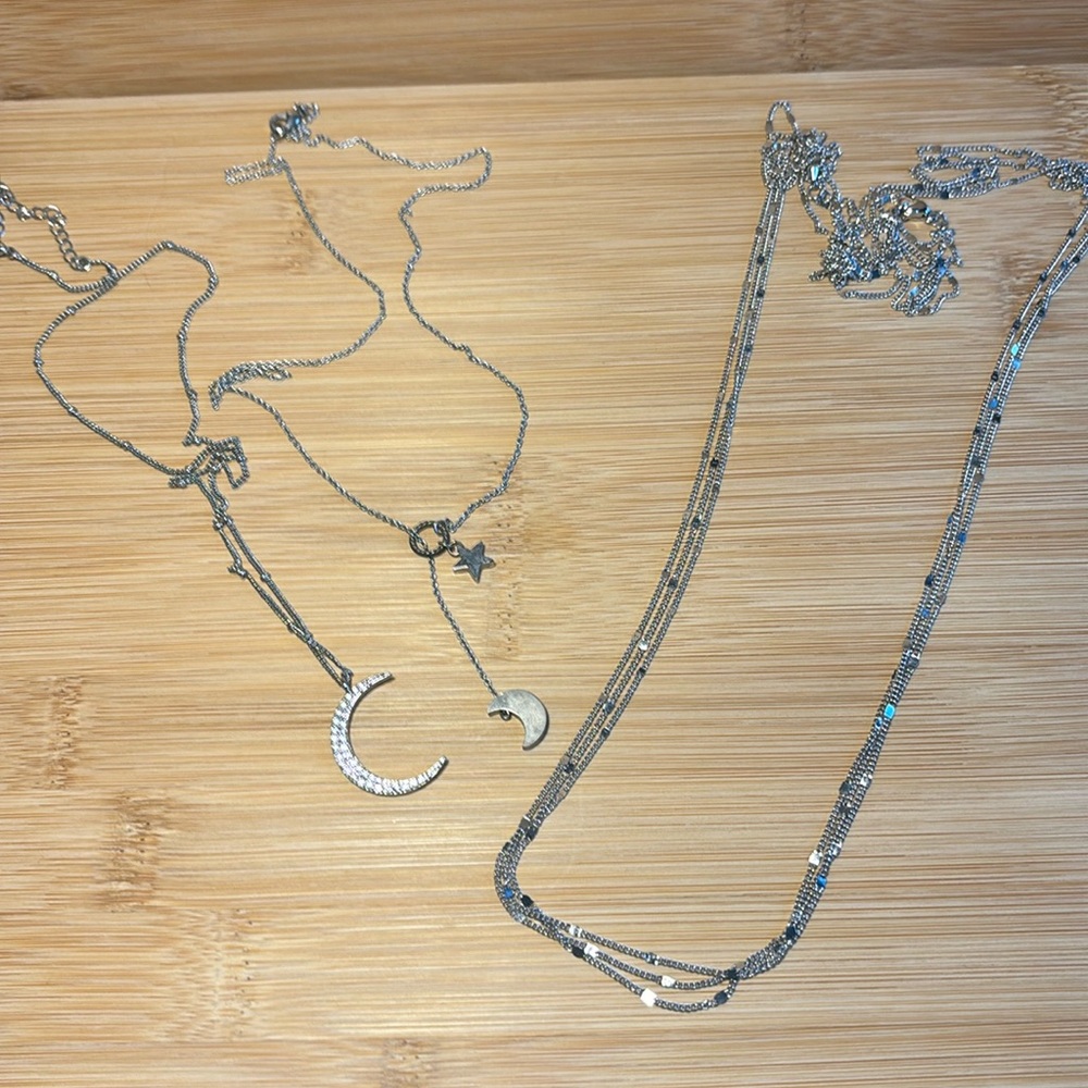 Bundle of 3 silver tone necklaces.